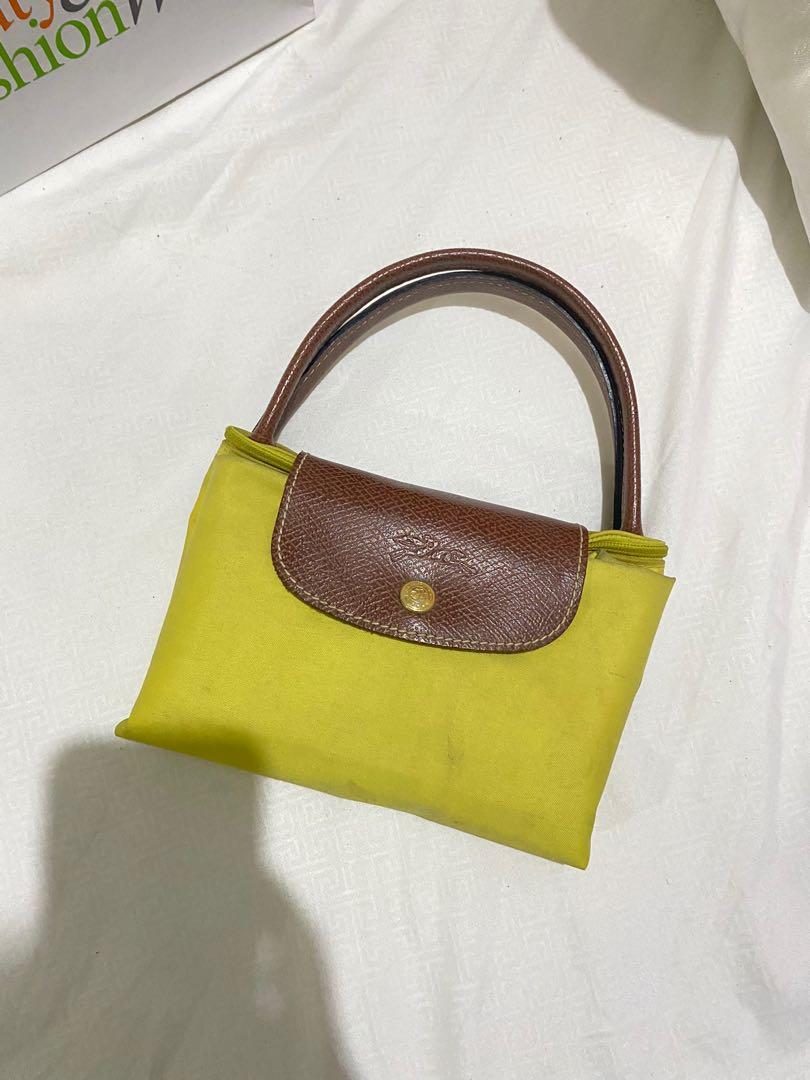 Preloved Authentic Longchamp Le Pliage (Category: Luxury Bags & Wallets) located in Cavite. Submitted by momxlittleonespreloved (Listing ID 1096825043, Image 2). Description: Preloved Authentic Longchamp Le Pliage 💯 Authentic Medium Size Short Handle Pls see attached photos for flaws In good condition See code for authenticity Php 2,000.00 ONLY!.