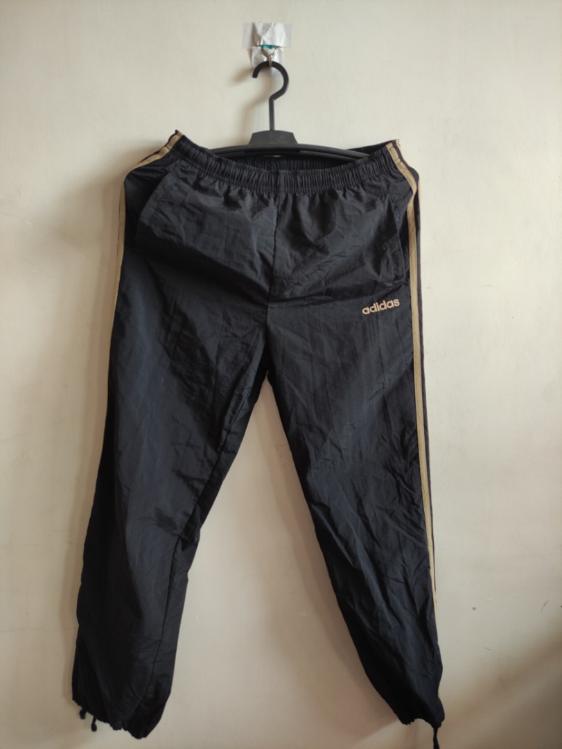 Adidas black and sales gold track pants