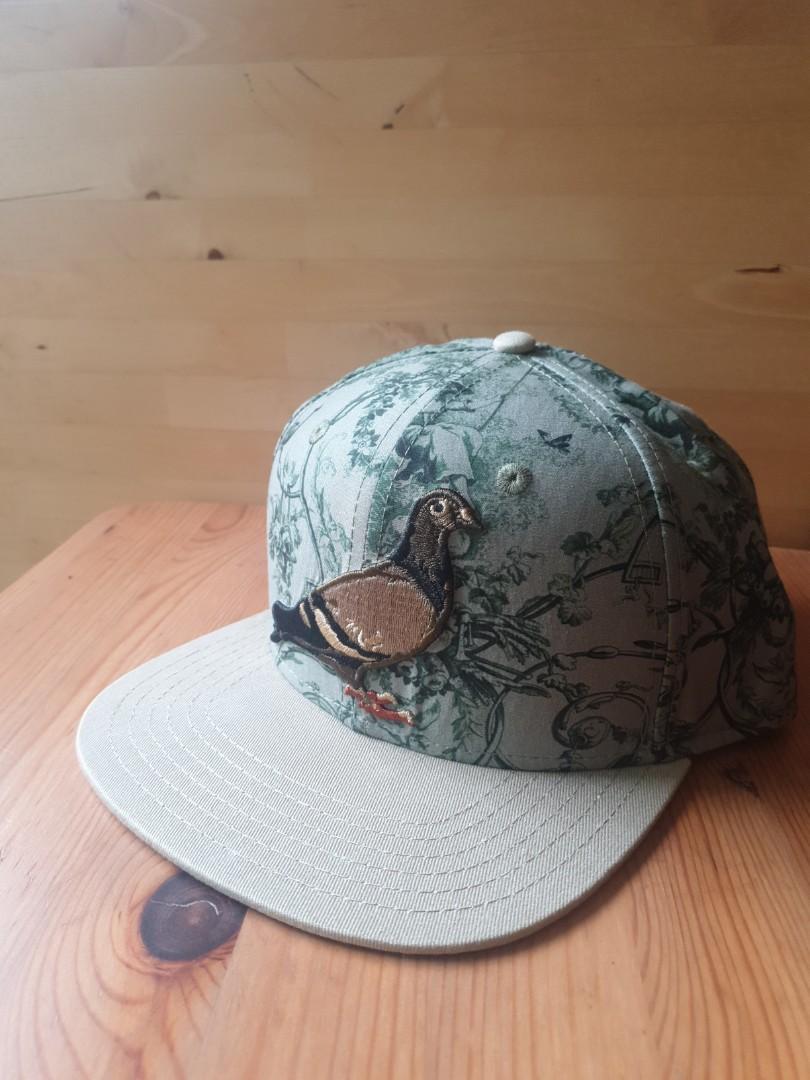 Staple outlet pigeon snapback