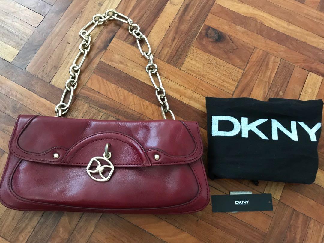 DKNY clutch/handbag (Category: Luxury Bags & Wallets) located in Paranaque City. Submitted by superpeanut (Listing ID 1097382592, Image 1). Description: DKNY red leather clutch/handbag with gold hardware Authentic Multiple compartments Magnetic closure Leather where magnet touches has rub marks but not noticeable when closed Used rarely. BPI deposit LBC only.