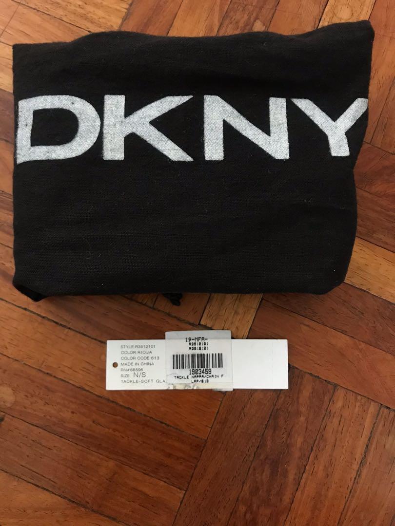 DKNY clutch/handbag (Category: Luxury Bags & Wallets) located in Paranaque City. Submitted by superpeanut (Listing ID 1097382592, Image 2). Description: DKNY red leather clutch/handbag with gold hardware Authentic Multiple compartments Magnetic closure Leather where magnet touches has rub marks but not noticeable when closed Used rarely. BPI deposit LBC only.