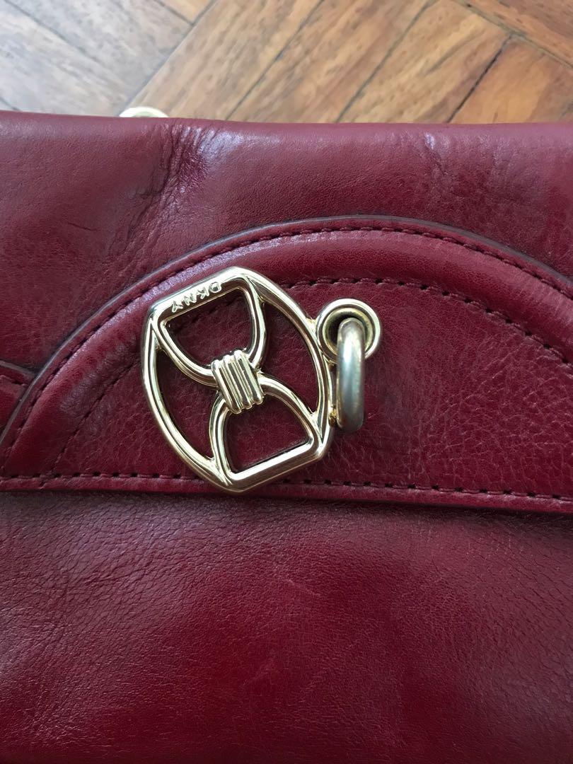 DKNY clutch/handbag (Category: Luxury Bags & Wallets) located in Paranaque City. Submitted by superpeanut (Listing ID 1097382592, Image 3). Description: DKNY red leather clutch/handbag with gold hardware Authentic Multiple compartments Magnetic closure Leather where magnet touches has rub marks but not noticeable when closed Used rarely. BPI deposit LBC only.