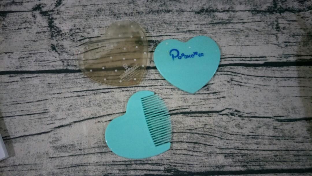 Authentic Vintage Sanrio Popshower mirror and comb set (Category: Mirrors) located in Paranaque City. Submitted by trinkets_by_joy (Listing ID 1091838667, Image 3). Description: AUTHENTIC MADE IN JAPAN VINTAGE COLLECTOR'S ITEM heart-shaped pocket comb and mirror set with mirror sleeve. comb in almost brand new condition (never carried) flaw - back part of the mirror (pls see photos) mirror sleeve discolored with age measurements (photos) conditio