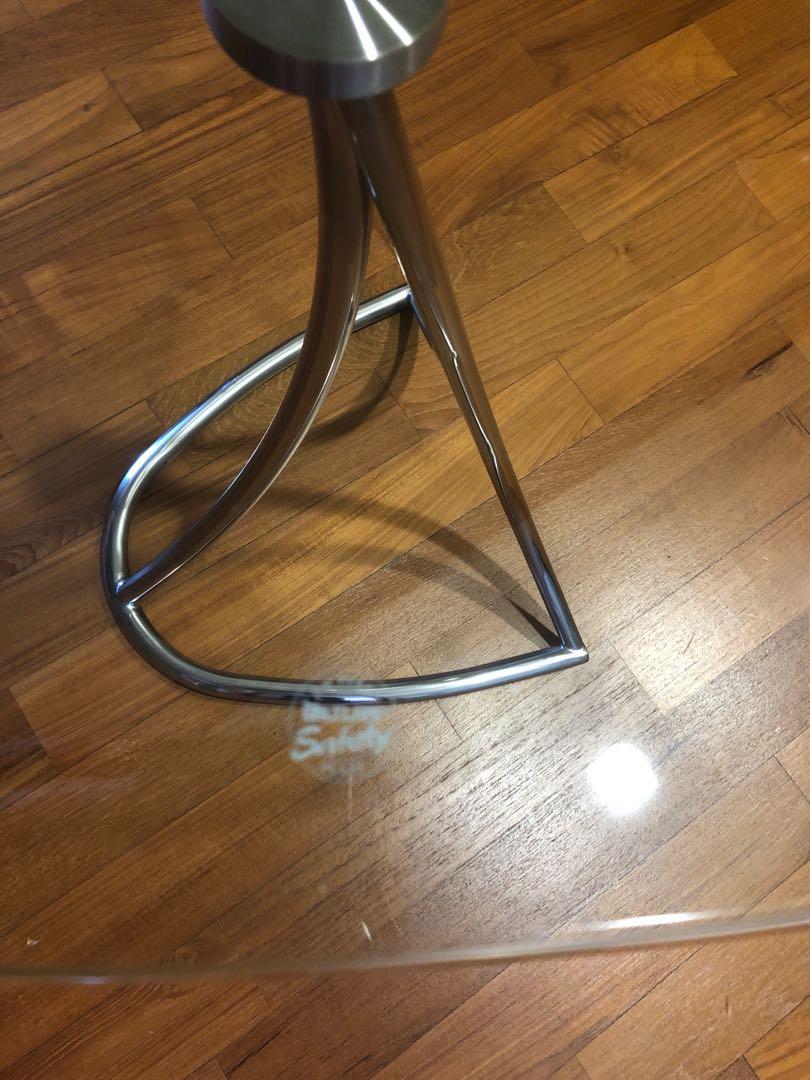 Side Table (Category: Tables & Sets) located in Singapore. Submitted by Murphy (Listing ID 1097608465, Image 3). Description: Can be used as side table or centre table between 2 sofa. Stainless steel leg with safety glass top. Good quality designer piece. Size about 21 inches (odd shape so base on maximum) .