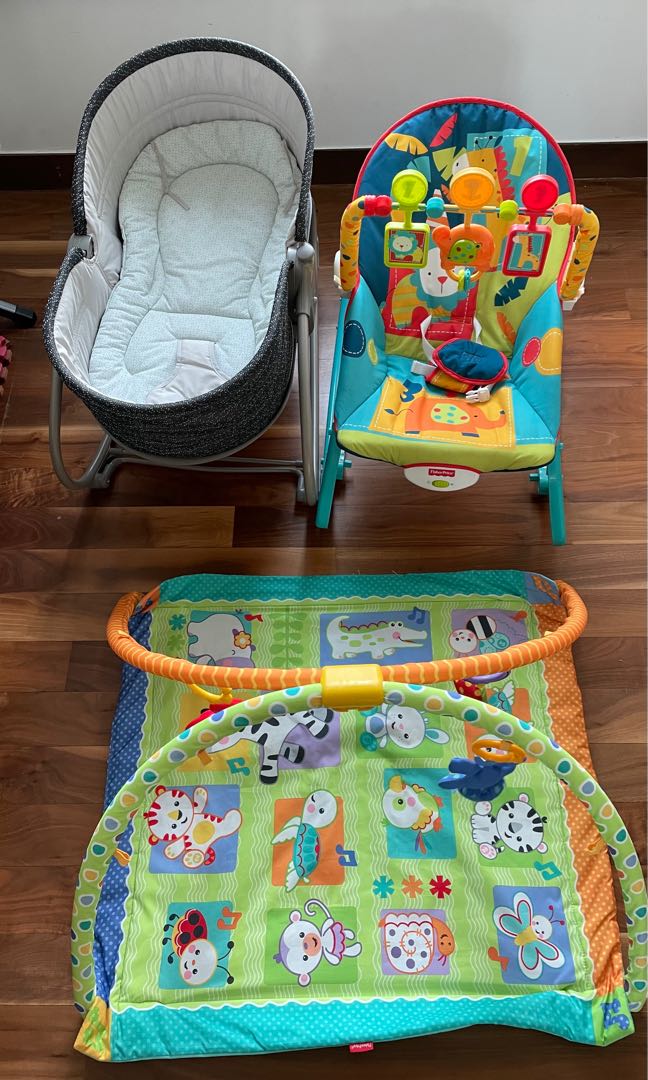 Gently used baby essential kit jumparoo, rocking chair, and