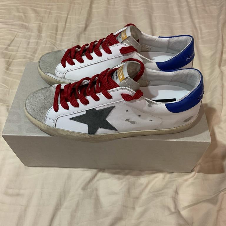 Golden Goose Super Star sneakers with blue heel tab and red laces
