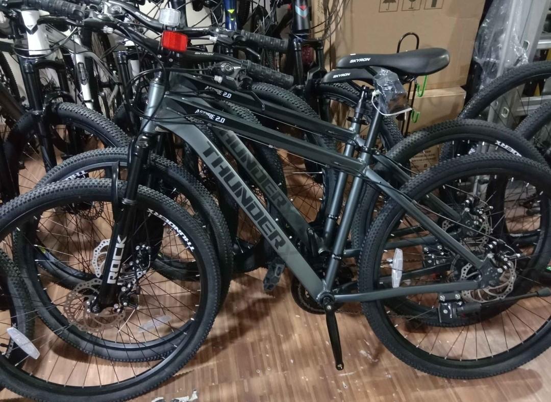 Thunder 27.5 Mountain Bike (Category: Bicycles) located in Muntinlupa City. Submitted by decluttergallery (Listing ID 1091936357, Image 1). Description: Thunder Aspire 2.0 27.5 Php 7,900 Cheaper Bike ever Color: Matt black & Red & Matt Gray & Black With Freebies SPECS: •Alloy frame •Internal Cabling •Mechanical Disk brake •3x7 speed Shiming groupset •Skyron handle bar •Stem skyron •Quick release setpost •Sealed bearing bottom bracket •Tire Nylon 