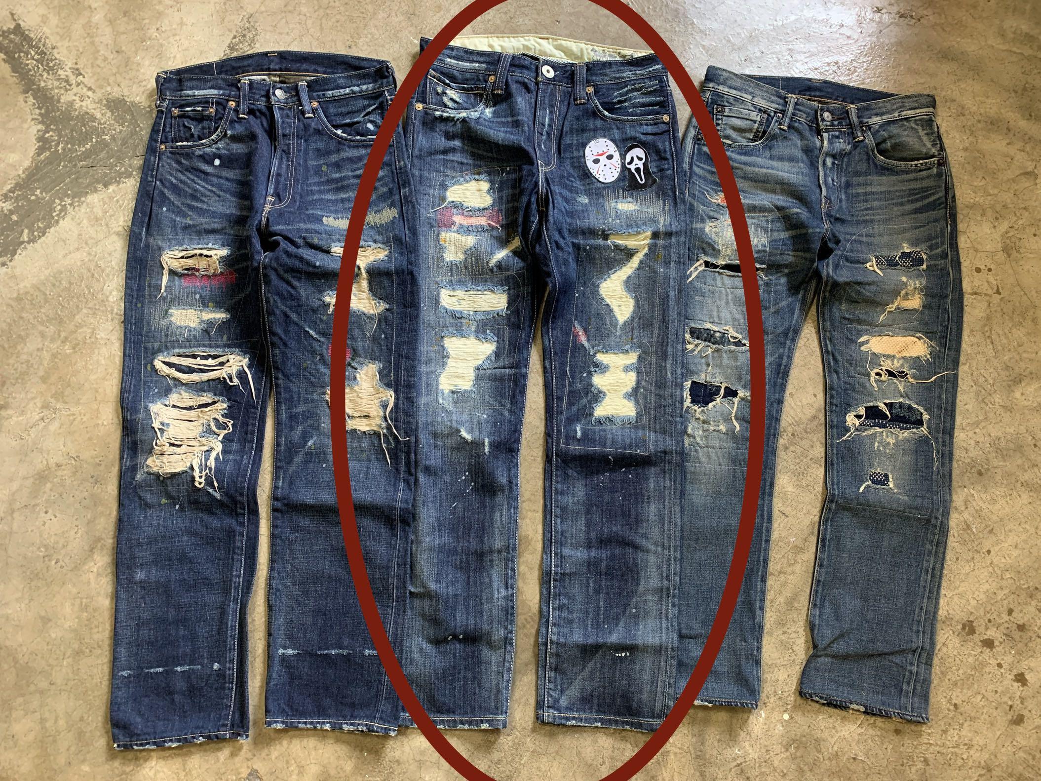 Levis damaged jeans discount