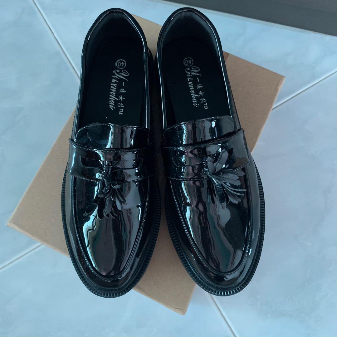 Black loafers glossy