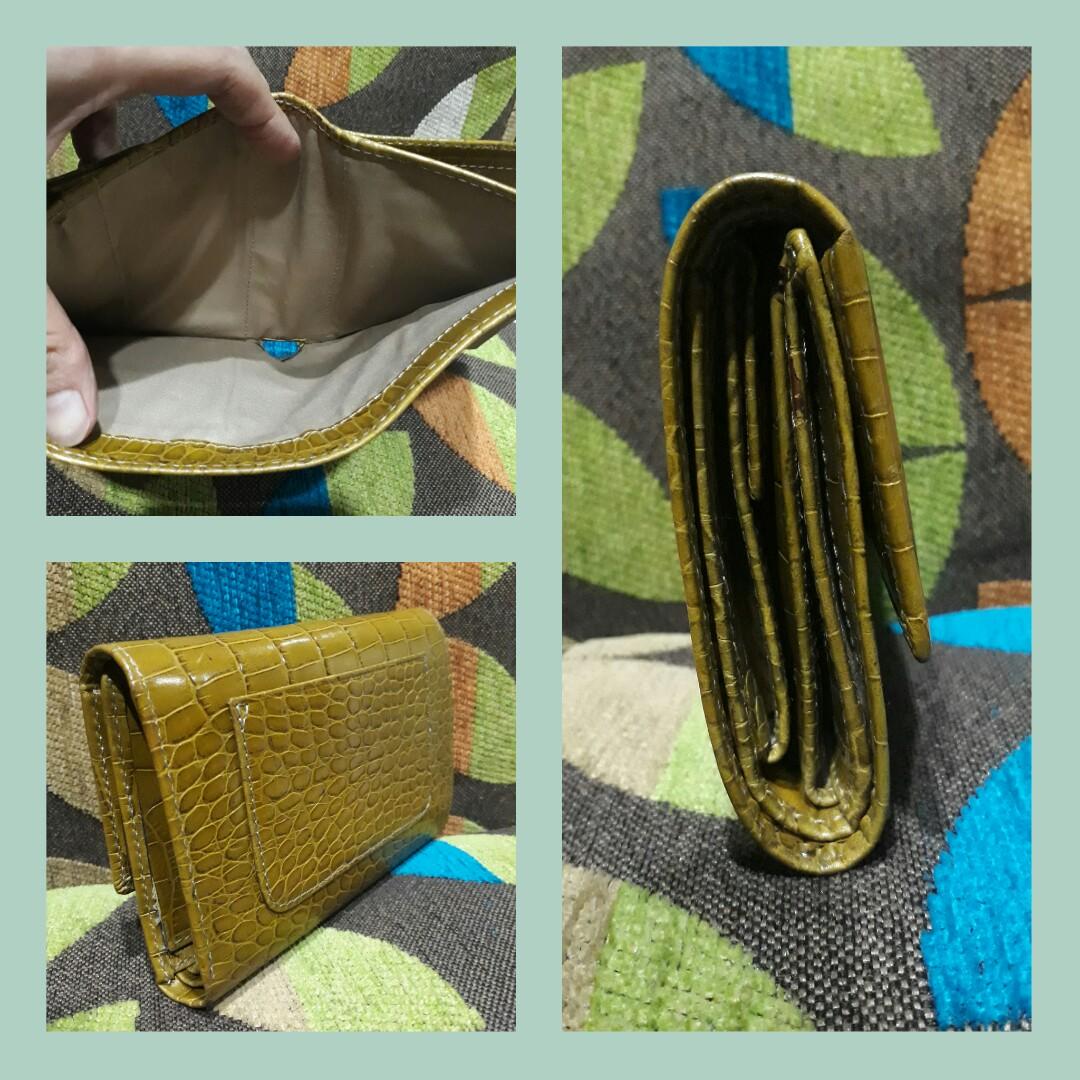 Fino Leatherware Tri-Fold Wallet (Category: Wallets & Card holders) located in Quezon City. Submitted by safeflower.62489b (Listing ID 1092547230, Image 3). Description: Color mustard Used few times only. In good condition except for a tear in one pocket. See last photo. Selling it because I don't need many pockets..