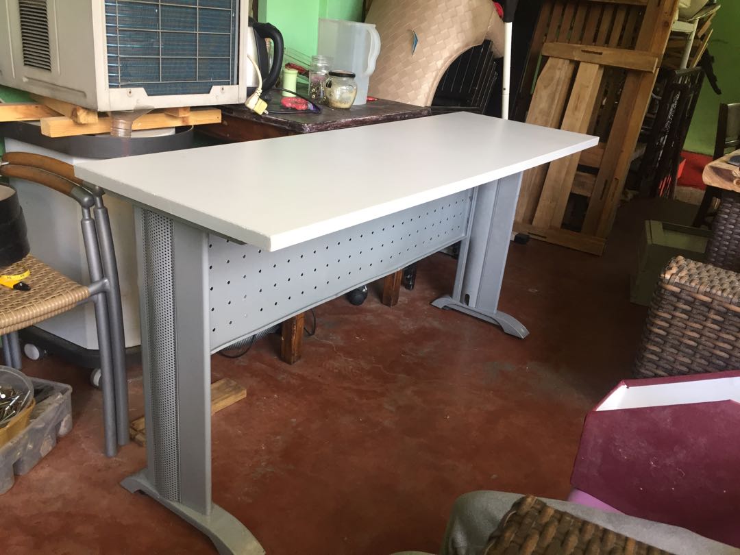 Second hand office table metal frame laminated wood top 59 inches long