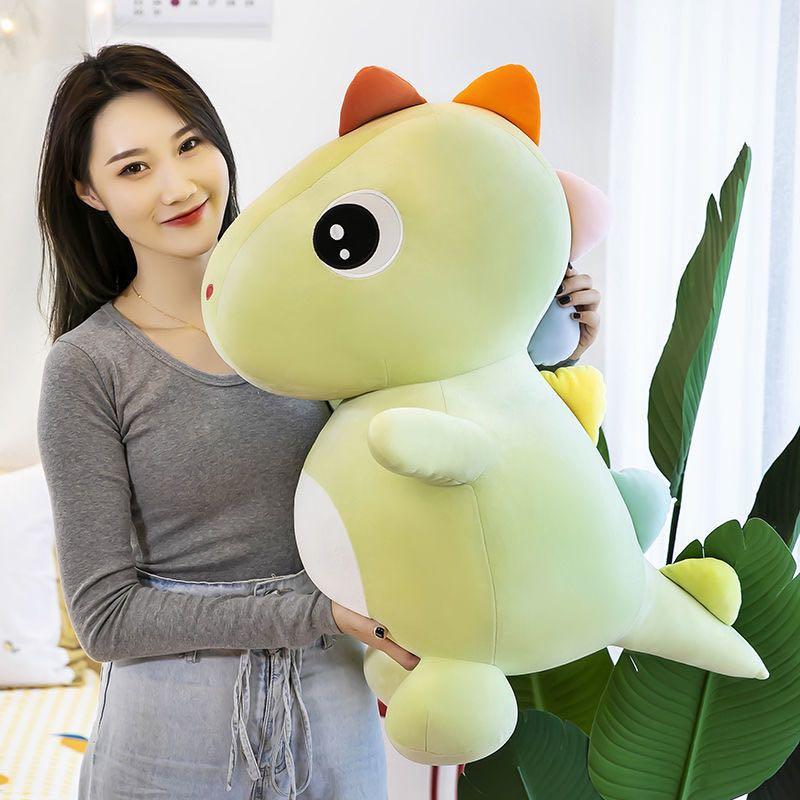 yellow stuffed dinosaur