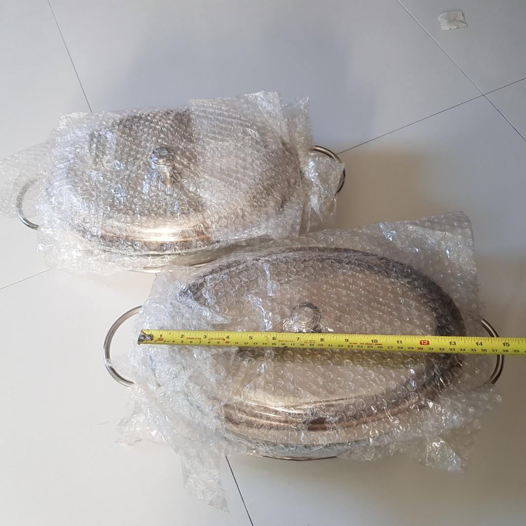 Chafing / Serving Dish (Category: Dinnerware & Cutlery) located in Manila. Submitted by happyberry888 (Listing ID 1092667890, Image 2). Description: Set of 2 Chafing dishes with glass insert (nice, thick glass) Never used. Slight discoloration on the edge of one silver cover but can easily be polished. Original box damaged from storage Rfs: Decluttering. Was a wedding gift Php 3,000 for both.