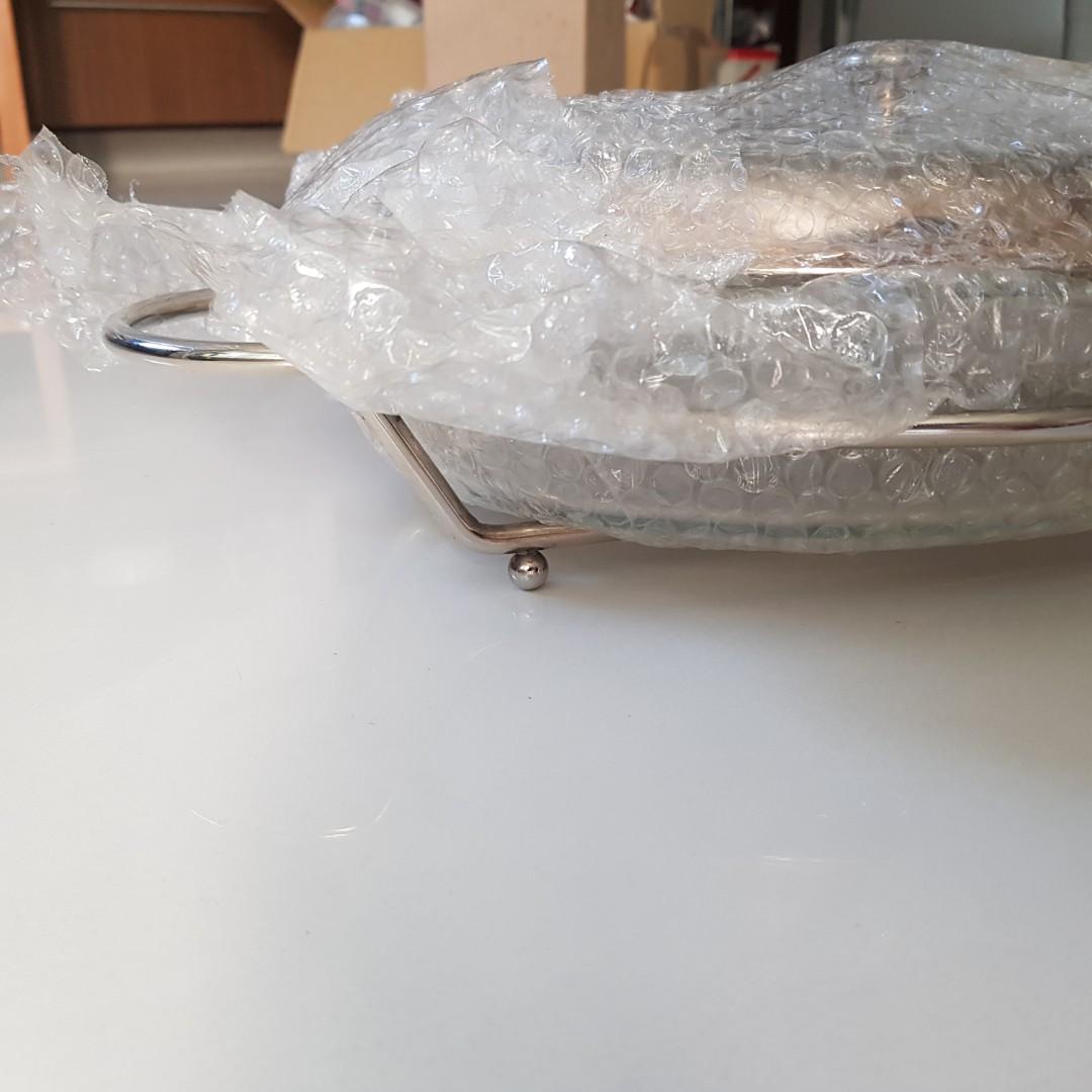 Chafing / Serving Dish (Category: Dinnerware & Cutlery) located in Manila. Submitted by happyberry888 (Listing ID 1092667890, Image 3). Description: Set of 2 Chafing dishes with glass insert (nice, thick glass) Never used. Slight discoloration on the edge of one silver cover but can easily be polished. Original box damaged from storage Rfs: Decluttering. Was a wedding gift Php 3,000 for both.