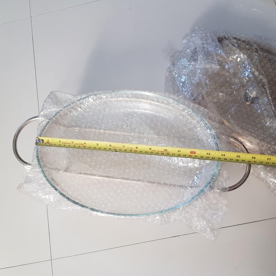 Chafing / Serving Dish (Category: Dinnerware & Cutlery) located in Manila. Submitted by happyberry888 (Listing ID 1092667890, Image 1). Description: Set of 2 Chafing dishes with glass insert (nice, thick glass) Never used. Slight discoloration on the edge of one silver cover but can easily be polished. Original box damaged from storage Rfs: Decluttering. Was a wedding gift Php 3,000 for both.