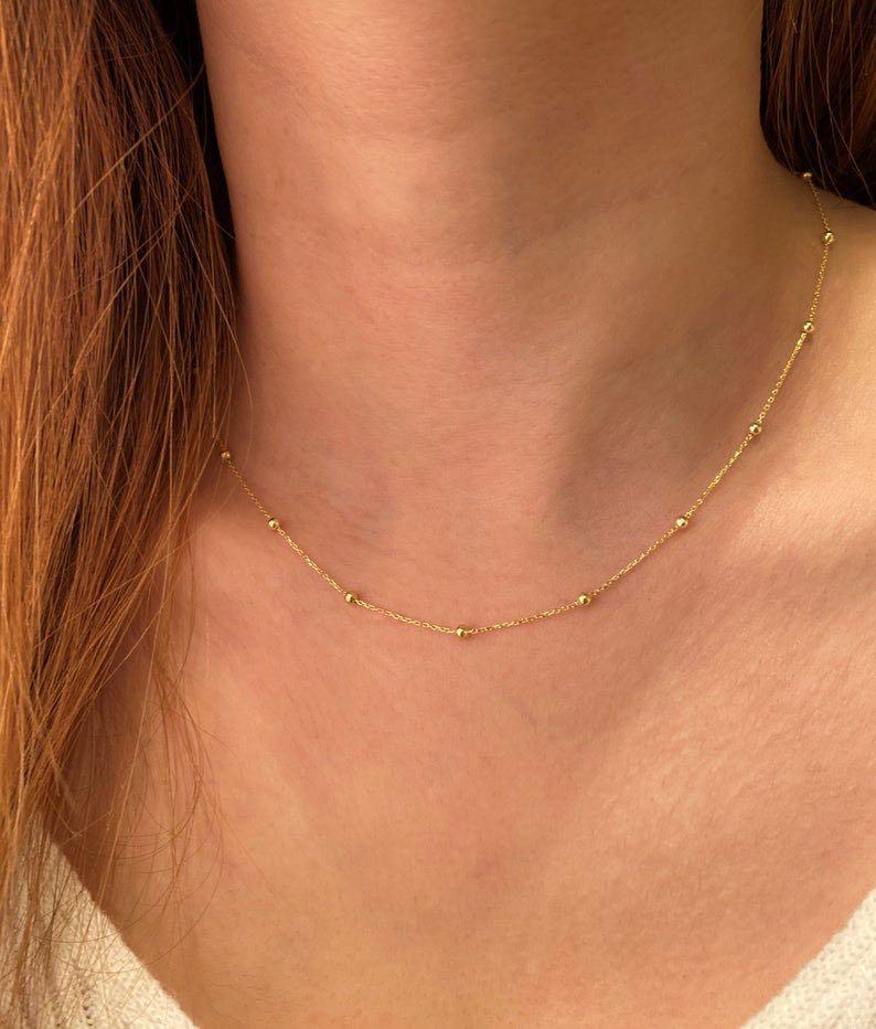 Gold bead deals pendant