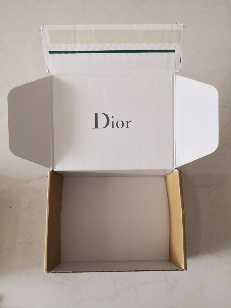 Overhead View of Dior Package Parcel with Gift Inside  Holiday Present Box  with Silk Logotype between Thin White Paper Editorial Photo  Image of  parcel christmas 167442716