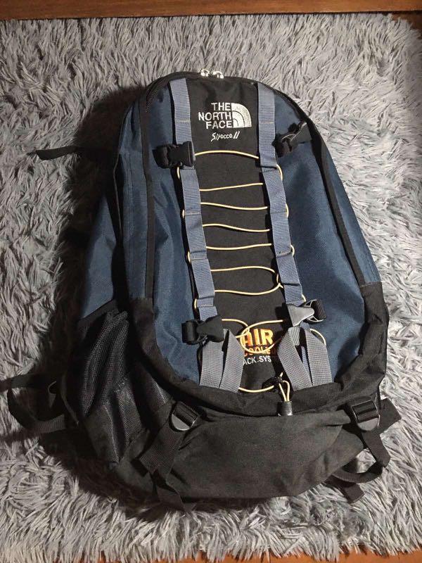 navy blue and rose gold north face backpack