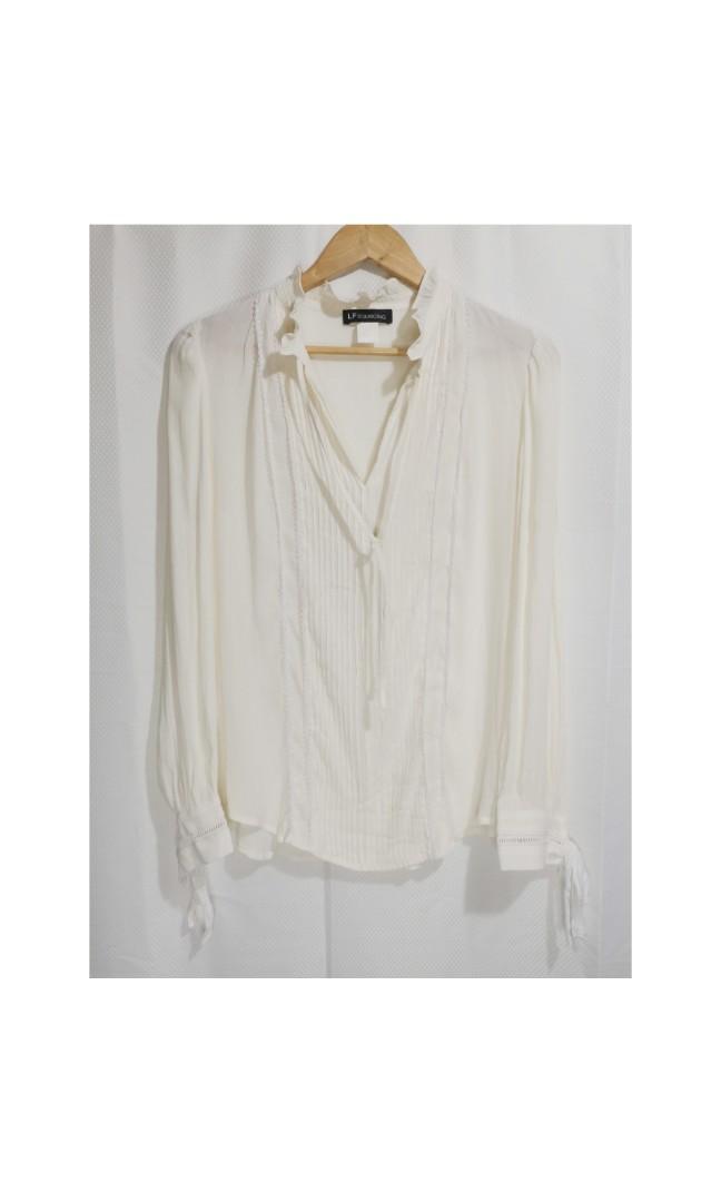 Ivory L/S preppy top (Category: Blouses) located in Mandaue City. Submitted by stylefigjam (Listing ID 1097798496, Image 1). Description: - Size: freesize (can fit body frames M to semi L comfortably) - in excellent condition - with adjustable ties infront and in both bottom sleeves - material is delicate; therefore, use mesh bag when doing laundry - gives you the preppy, fresh look - swipe to see a sample pic from Pinterest if you want to style 
