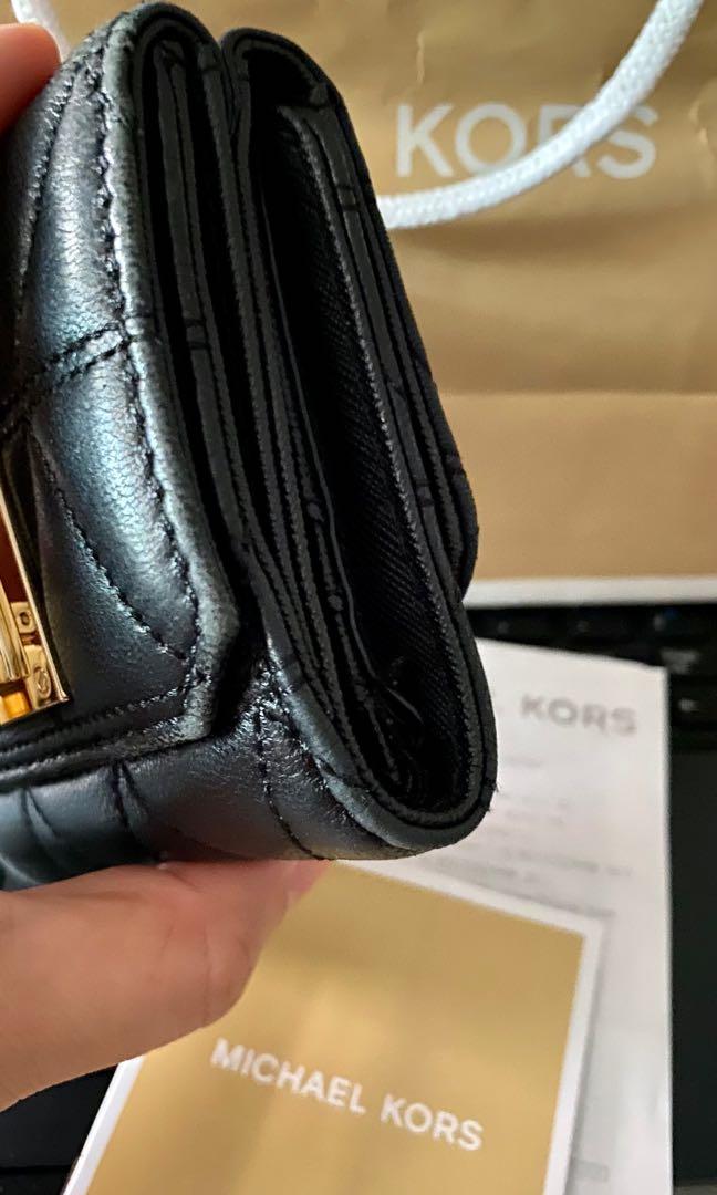Michael Kors compact wallet (Category: Luxury Bags & Wallets) located in Las Pinas. Submitted by chubbychobs2012 (Listing ID 1097796081, Image 2). Description: 🚩 💯 original 🚩 bought from a trusted seller here in carousell 🚩 seldom used; see last photo when I first got the wallet 🚩 looks like chanel (you can also add a gold bag chain to add accesory to your OOTD) 🚩 final price posted (no haggling, bought for 4,500 + SF) 🚩 RFS: too many SLGs