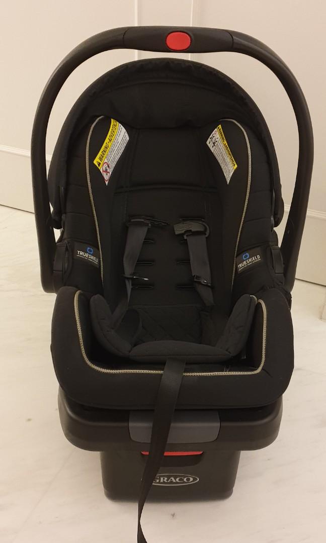 Graco SnugRide SnugLock 35 LX featuring TrueShield Technology car seat baby with base