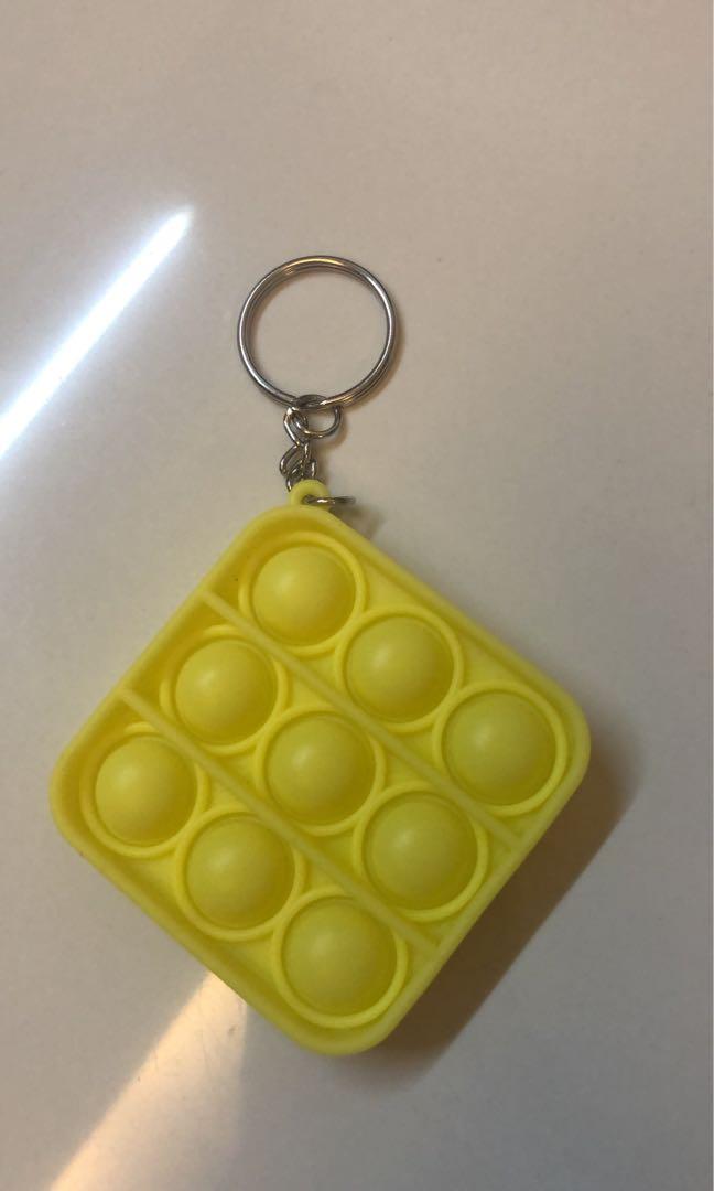 yellow square mini pop it, Hobbies & Toys, Toys & Games on Carousell