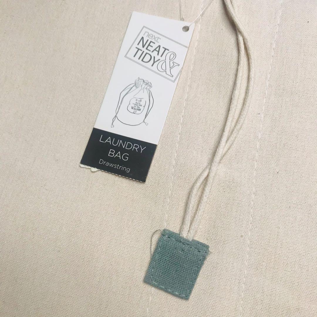 Laundry Bag (Category: Laundry Baskets) located in Paranaque City. Submitted by decluttering.diva (Listing ID 1099958539, Image 3). Description: Next Neat & Tidy Laundry Bag - drawstring type - bought from US - off-white color, made of durable canvas material - unused, has signs of canvas color discoloration due to storage - 66cm Height x 35cm Diameter.