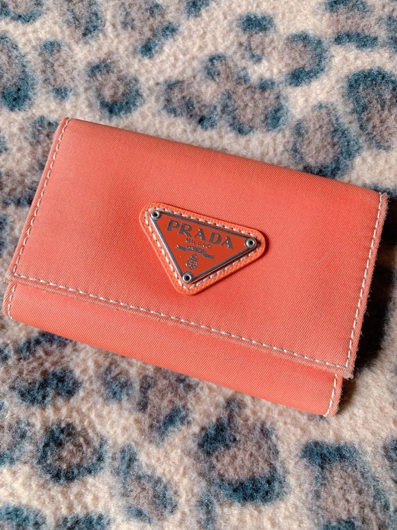 Prada key holder wallet (Category: Luxury Bags & Wallets) located in Malabon City. Submitted by akbeautique (Listing ID 1100008146, Image 1). Description: authentic Prada key holder with authenticity card. With normal signs of usage..