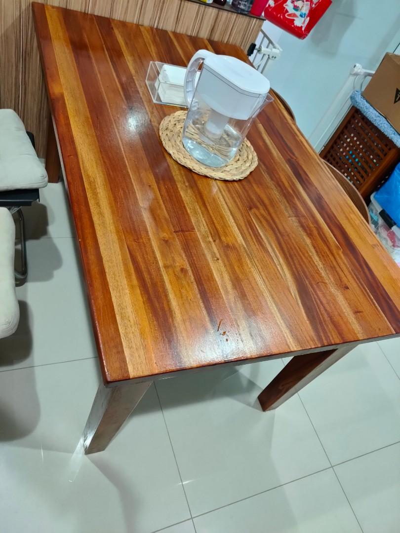 Solid teak dining table (Category: Tables & Sets) located in Singapore. Submitted by angelhshop (Listing ID 1100128715, Image 1). Description: 1.5m dining table very good solid wood beautiful wood grains seats 6 pax comfortably 150 X 90 X 77cm to arrange delivery on your own.
