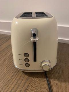 Beautiful cute cream color toaster machine