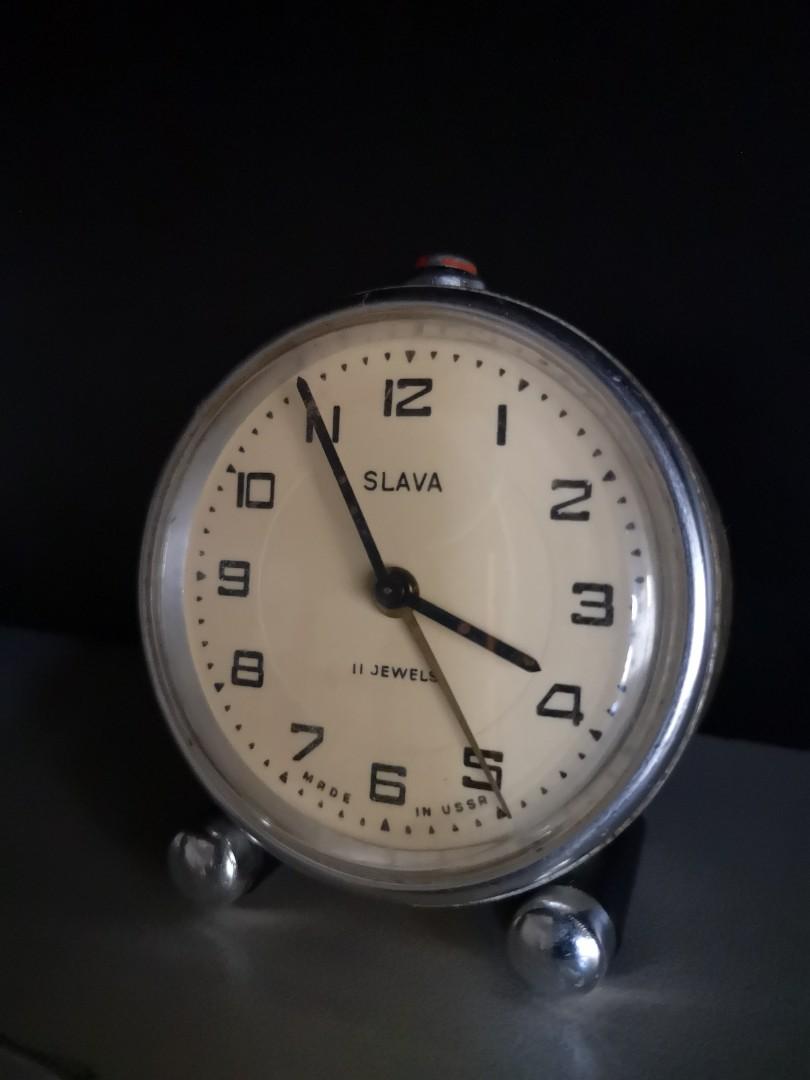 Russian Clock SLAVA Alarm Bell Table Bedside (Category: Clocks) located in Manila. Submitted by leo.7 (Listing ID 1100468221, Image 2). Description: SLAVA Mechanical Alarm clock ⏰ Russian Made 11 jewels 50s-60s Very good working order Including bell alarm Nice consistent patina from European weather Great condition on dial and Arabic numerals "Made in USSR" written in English (Exported to Europe) 🏠🏚️🏰 Recently serviced Obtained from Austrian V