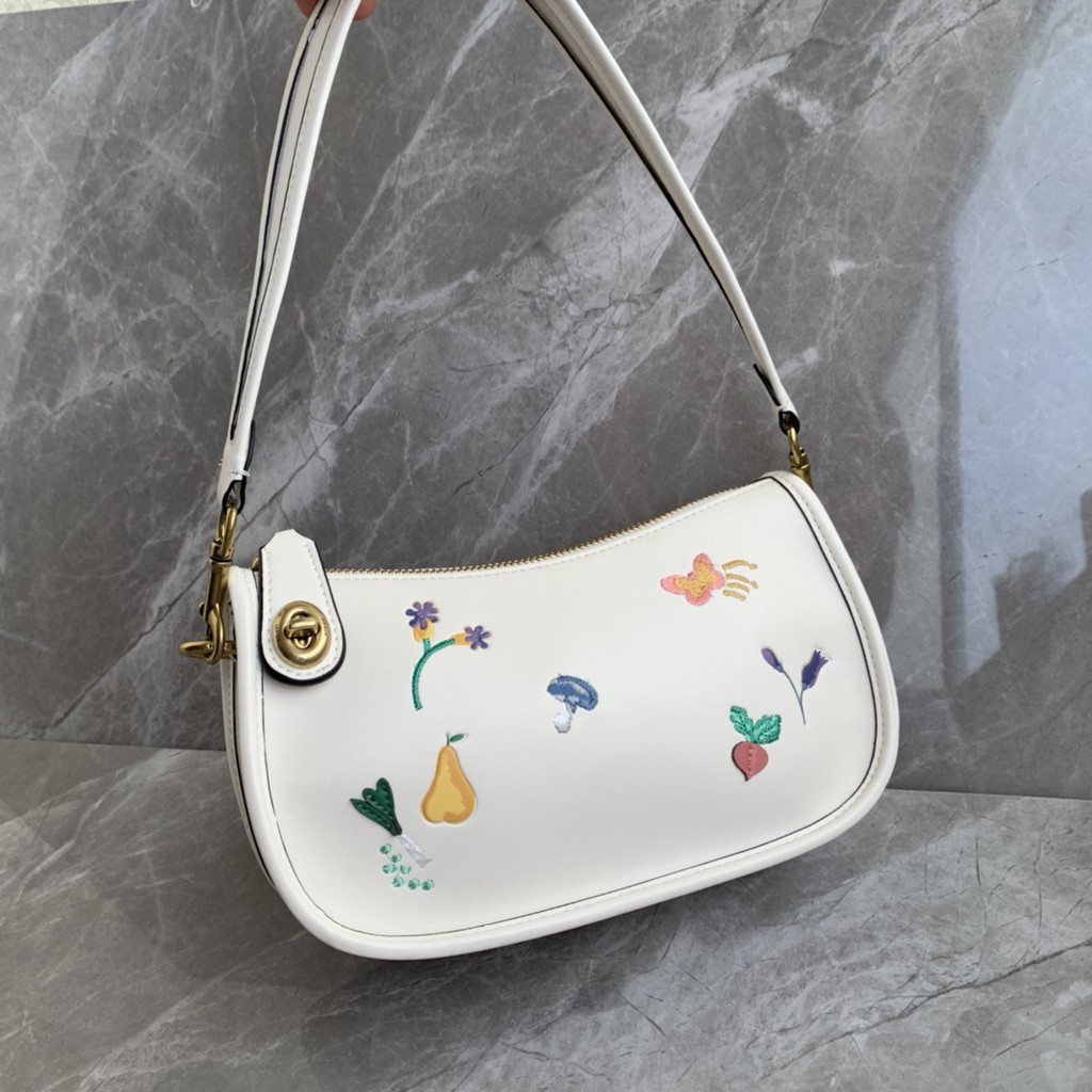 swinger bag with garden embroidery coach