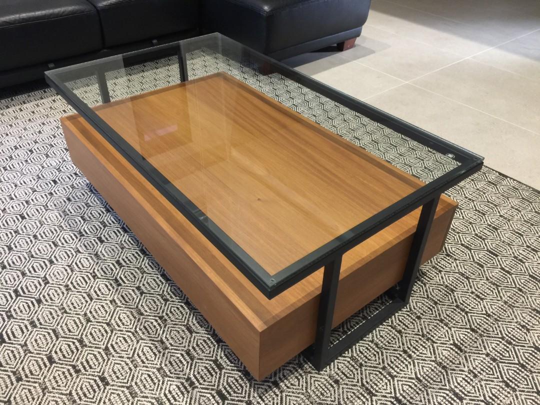 Modern Wooden Center Table (Category: Tables & Sets) located in Quezon City. Submitted by njoy888 (Listing ID 1100736818, Image 2). Description: Pre-order in 30 days Brand New Architect's Design Industrial Modern Center Table Size: width 70cm x length 1200cm height 44cm Real Wood: African Akoume Hard Wood Color: Teak 10mm Thick Tempered Glass Top 1inch Heavy-Duty Painted Lacquer Finish Tubular Metal Frame With two large drawers for storage Two la
