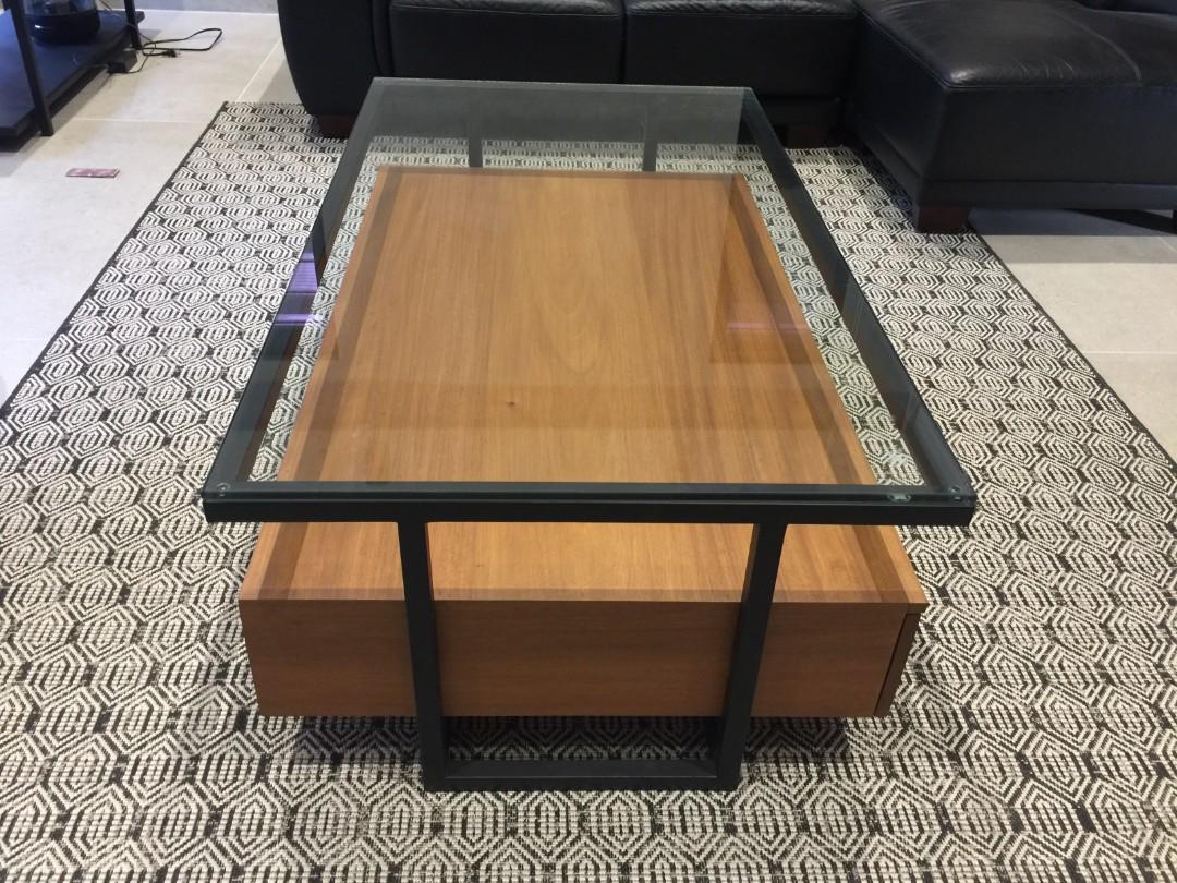 Modern Wooden Center Table (Category: Tables & Sets) located in Quezon City. Submitted by njoy888 (Listing ID 1100736818, Image 3). Description: Pre-order in 30 days Brand New Architect's Design Industrial Modern Center Table Size: width 70cm x length 1200cm height 44cm Real Wood: African Akoume Hard Wood Color: Teak 10mm Thick Tempered Glass Top 1inch Heavy-Duty Painted Lacquer Finish Tubular Metal Frame With two large drawers for storage Two la