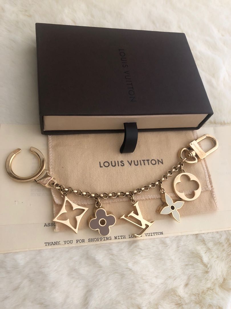 Shop Louis Vuitton LOCKME Fleur de monogram bag charm chain