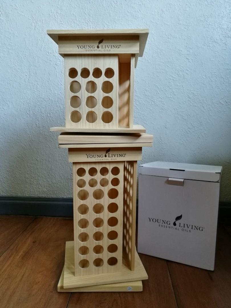 Young Living Essential Oil Rotating Rack (Category: Storage Boxes & Baskets) located in Quezon City. Submitted by fireflychic (Listing ID 1100909065, Image 3). Description: · authentic · brand new · with Box · Young Living · Essential Oil · Rotating Rack Display · Light Colored · Pine Wood · 9.5 " x 9.5" x 15 " · with swivel Base · 104 slots in total · 32 slots for 5ml bottles · 72 slots for 15 ml bottles · side tectangular slot for books / Catal