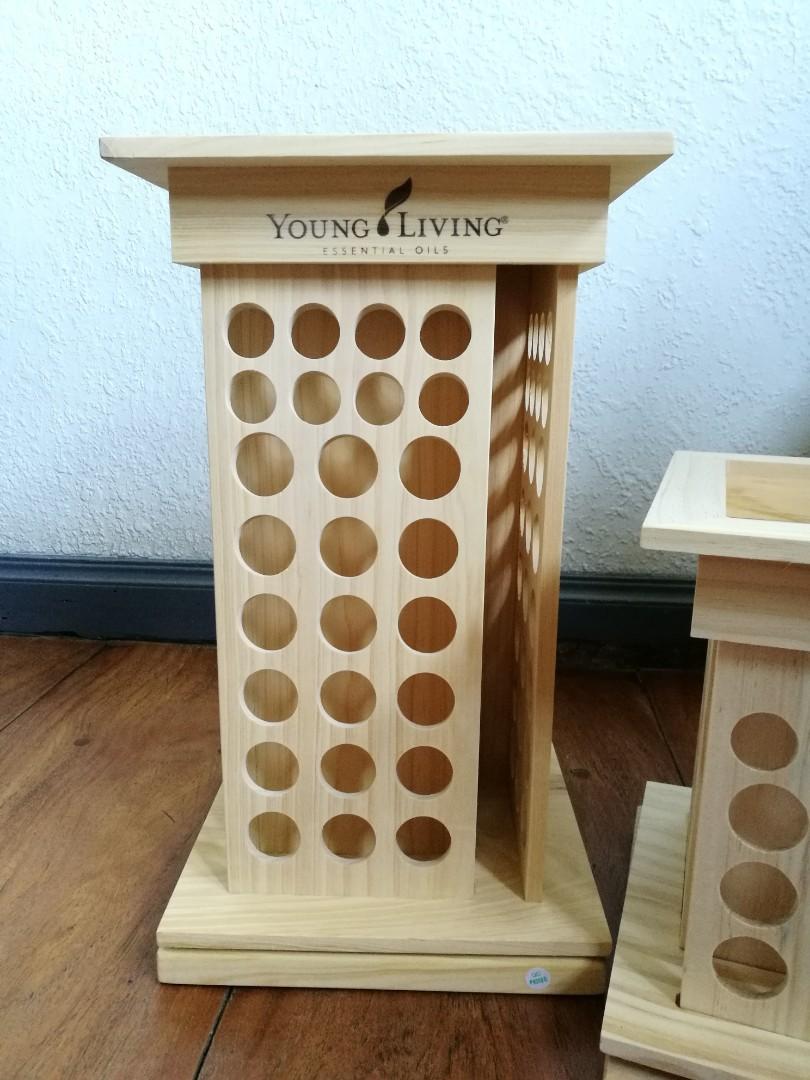 Young Living Essential Oil Rotating Rack (Category: Storage Boxes & Baskets) located in Quezon City. Submitted by fireflychic (Listing ID 1100909065, Image 1). Description: · authentic · brand new · with Box · Young Living · Essential Oil · Rotating Rack Display · Light Colored · Pine Wood · 9.5 " x 9.5" x 15 " · with swivel Base · 104 slots in total · 32 slots for 5ml bottles · 72 slots for 15 ml bottles · side tectangular slot for books / Catal