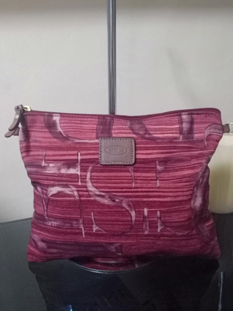 Bric's Milano Pouch (Category: Luxury Bags & Wallets) located in Quezon City. Submitted by lamoure_demavie (Listing ID 1101118773, Image 1). Description: -preloved -lim.edition -rare -small(approx.:10.5 in length) -silk nylon fabric -with optional sling slots -with back snap lock(if use as extra compartment for your bag) -signs of use.