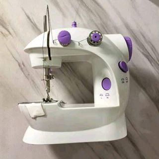Mini Portable Electric Sewing Machine With 2 Speed Control.