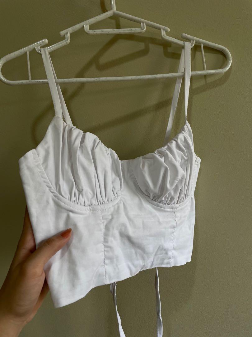 White Ruched Bust Top (Category: Blouses) located in Muntinlupa City. Submitted by hellotia (Listing ID 1101297427, Image 2). Description: • super cute top!! bought it on shopee but the size is too small for me • size: XS - S • good as new • stretchable fabric • (this top will make you look busty) • feel free to message me if you have anymore questions about the garment! • used once.