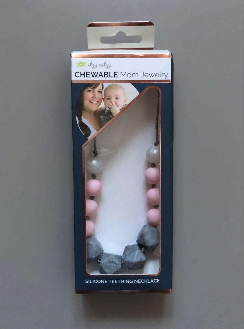Itzy Ritzy Teething Necklace (Category: Soothers & Pacifiers) located in Quezon City. Submitted by beautyhaulmanila (Listing ID 1101574221, Image 1). Description: Itzy Ritzy Chewable Mom Jewelry. The box got squished due to being stored for some time. The necklace itself is in very good condition. Bought this in the US..
