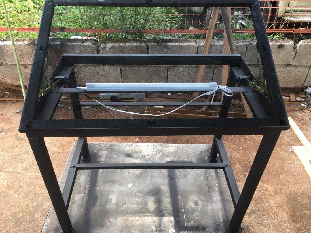 Tempered Glass Drafting Table (Category: Office Furniture & Fixtures) located in San Pedro. Submitted by draftingtablemaker (Listing ID 1101563846, Image 3). Description: Drafting Table with Tempered Glass-60cm x90cm Height: 80cm Dual Mechanism to tilt Tubular Metal Frame.