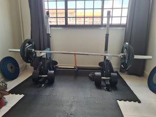 Half rack with barbell and weights