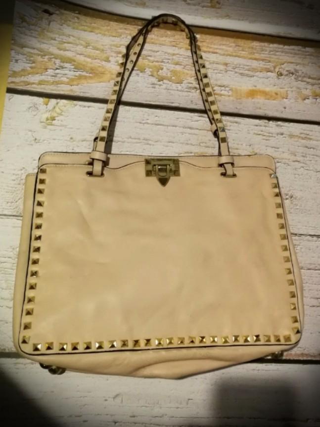 Valentino Garavani studded tote (Category: Shoulder Bags) located in Quezon City. Submitted by fortunebasket (Listing ID 1098109376, Image 1). Description: No code. Details and condition of the bag is posted. Gold hardware, pure leather, light pink Studs are intact. Minor scratches Self authentication is advised..