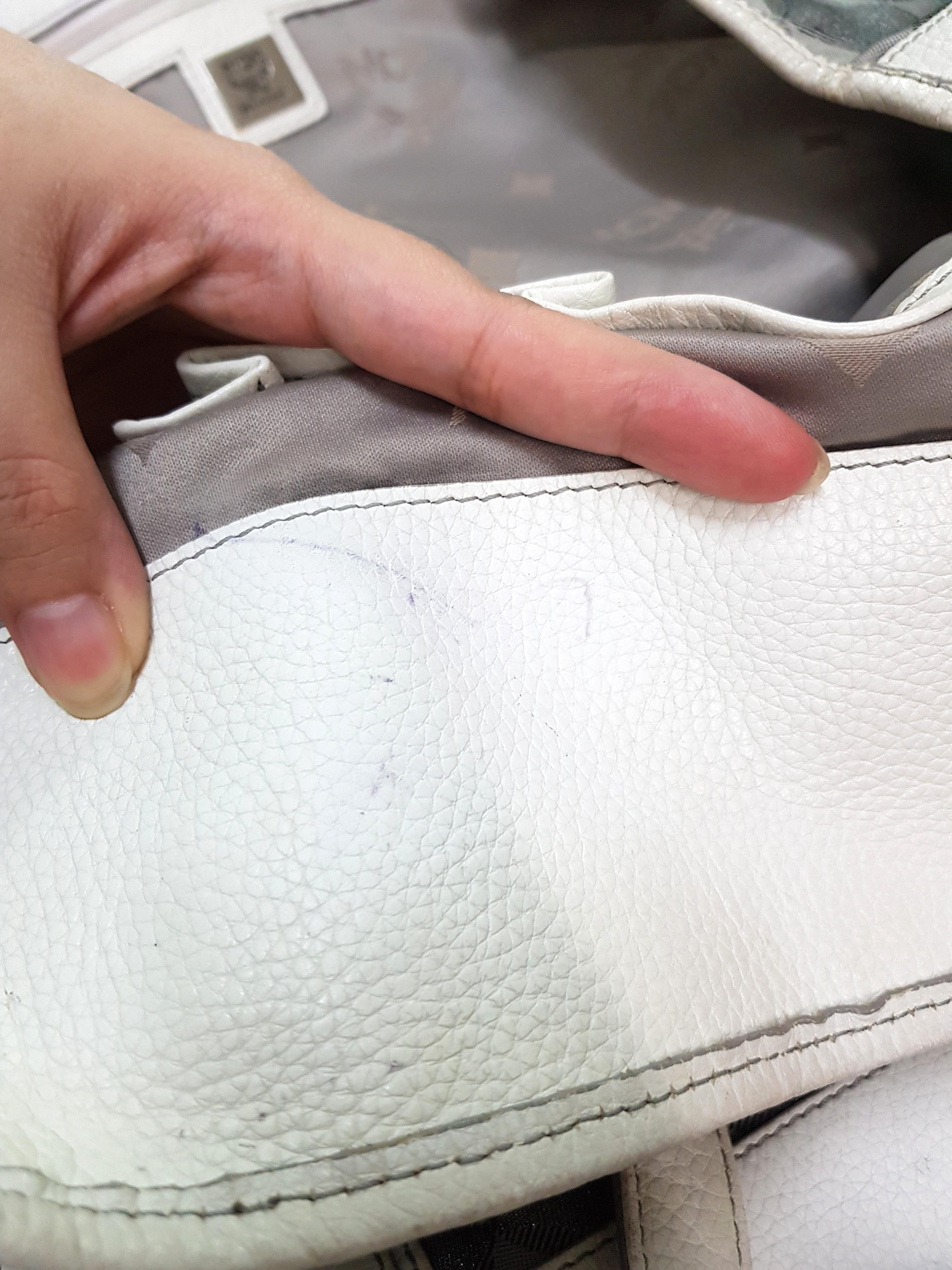Authentic Mcm Weekender or Shopper Tote (Category: Luxury Bags & Wallets) located in Antipolo. Submitted by dlolin (Listing ID 1101950046, Image 3). Description: This is large size. No to low ballers. I just want to declutter No issues just pen marks and signs of use like rubbings on corners. Pouch included. Used as mommy bag only.