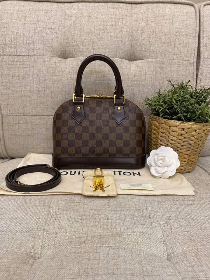 Louis Vuitton Alma BB in Damier Ebene 2017 (Category: Luxury Bags & Wallets) located in Manila. Submitted by bagislifeshop (Listing ID 1102078094, Image 2). Description: Yassss!!! We have one!!! 🌟🌟🌟 On Hand in PH🇵🇭 100% Authentic LV Alma BB in Damier Ebene 2017 Condition: 9/10 Comes with Dustbag, Lockset, Tag and Strap.