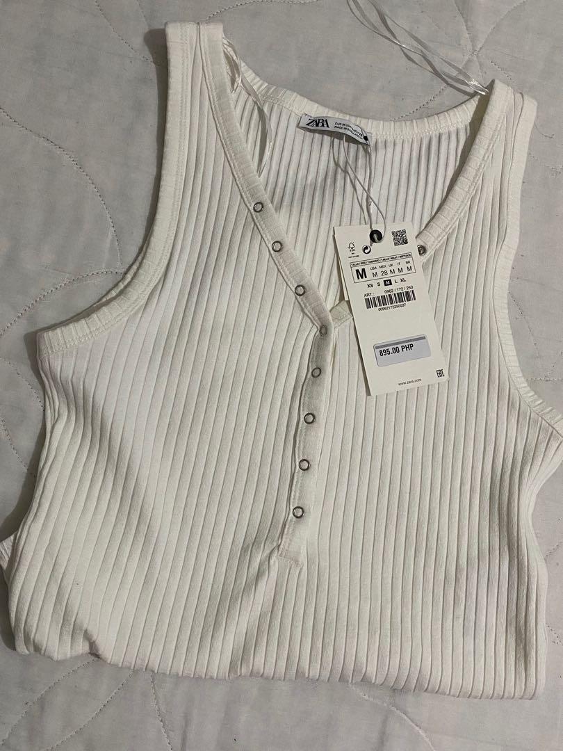 Zara Ribbed Bodysuit (Category: Others Tops) located in Quezon City. Submitted by mrvcs (Listing ID 1102137534, Image 3). Description: V neck bodysuit with wide straps. Snap-button detail on the front. Snap-button fastening at the bottom. Brand new RFS: not my size Slightly negotiable😅.