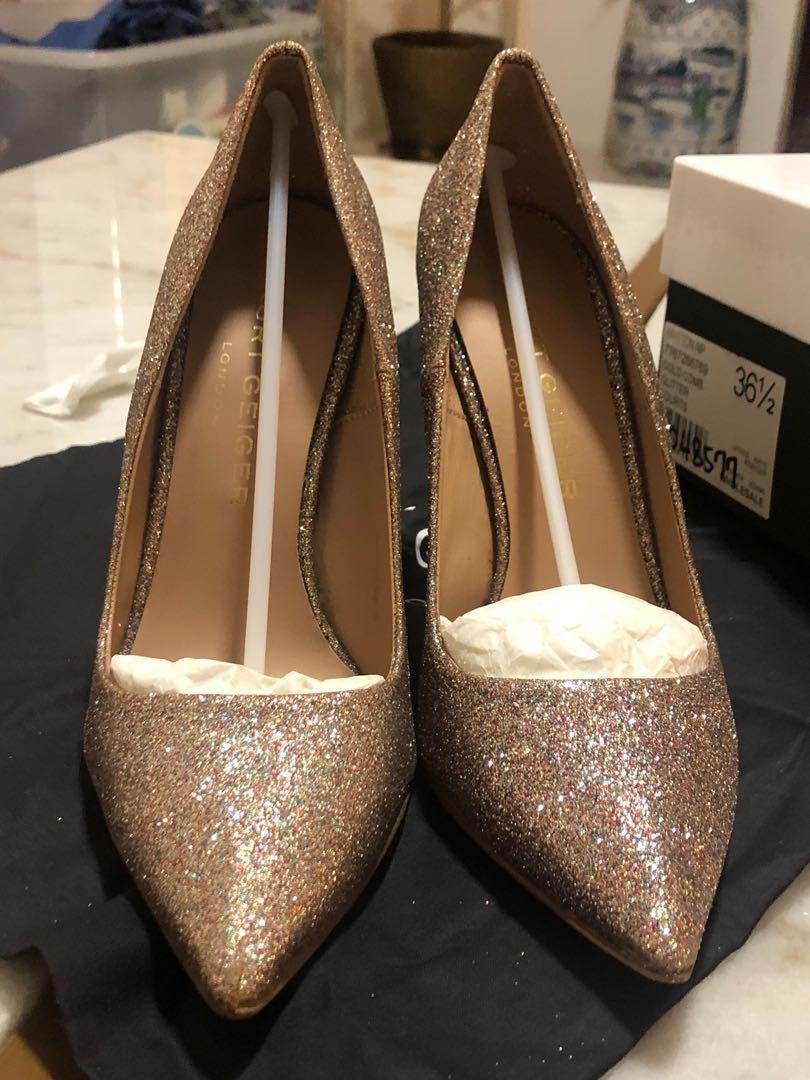 Kurt Geiger Gold Heels Glitter Pumps (Category: Heels) located in Quezon City. Submitted by desberin (Listing ID 1102297535, Image 2). Description: Kurt Geiger Pumps Size 36.5 Complete with box and dust bag When I bought it I didn’t notice the defect on the tip of the right pump. But it’s not really visible from a far. Rfs: Decluttering Pick - up: 📍 Main Ave. Cubao QC 📍 Market! Market! BGC Shipping fee c/o buyer.