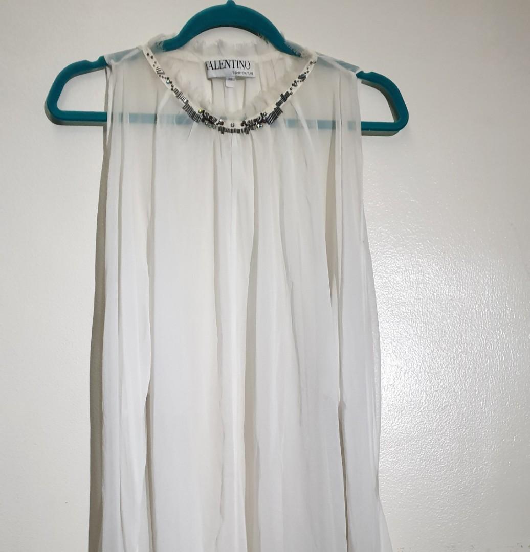 Valentino T-shirt Couture (Category: Blouses) located in Mandaluyong City. Submitted by purselove (Listing ID 1102325171, Image 1). Description: *Authentic, beautiful and definitely unique Valentino T-shirt Couture long sheer viscose top with beaded detailing on cuffs and neckline *May be worn as a top or as a dress with a slip camisole innerwear * Will fit XS to Large but neckline is just a little narrow to fit head through (no buttons) *Last 4 