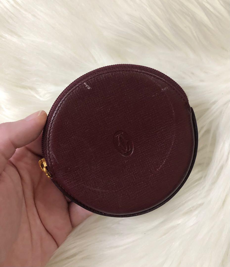 Authentic Cartier Round Coin Case / Purse (Category: Luxury Bags & Wallets) located in Makati City. Submitted by cindiorella (Listing ID 1102604555, Image 3). Description: No inclusions With obvious signs of use With slight storage smell Please see photos carefully for item’s condition.